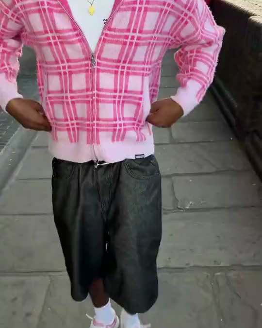 Two More Money More Love outfits in motion: pink check jacket and white jersey with the number 10