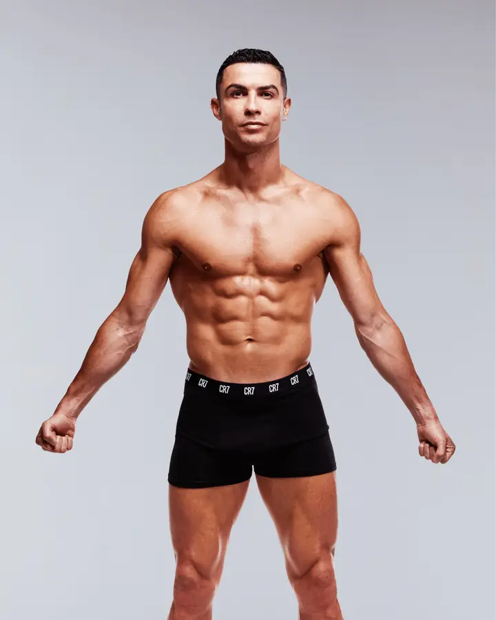 Athletic shirtless man in black CR7 boxer briefs in the studio